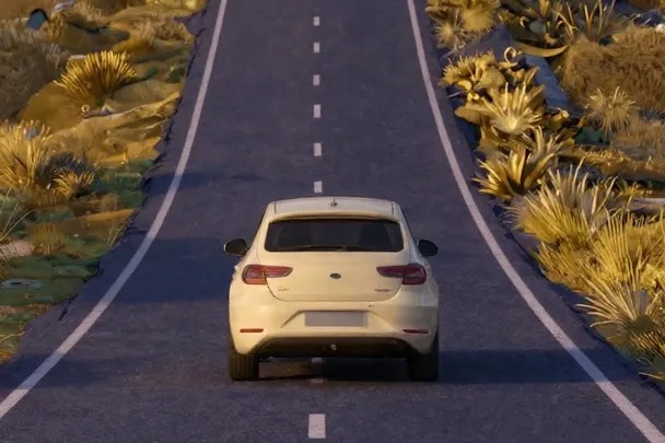 Coche sin marcas avanza por una carretera rural despejada