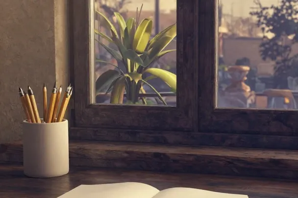 Escritorio vacío y ordenado espera junto a una ventana al amanecer