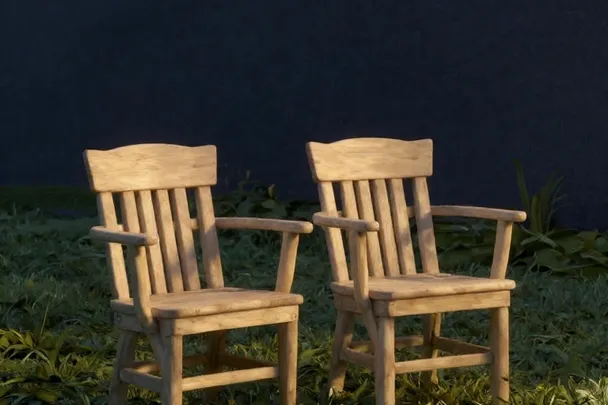 Dos sillas vacías se orientan hacia el mismo jardín tranquilo