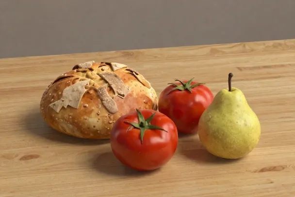 Pan rústico, tomates y una pera sobre una mesa de madera.